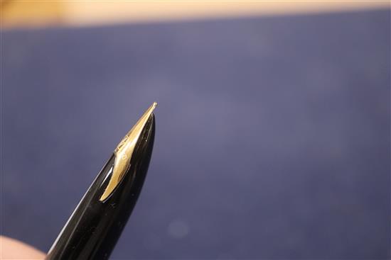 A group of five vintage fountain pens, including a Watermans orange and black marble effect pen